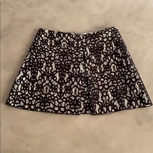 Mini skirt: embroidered black patterned